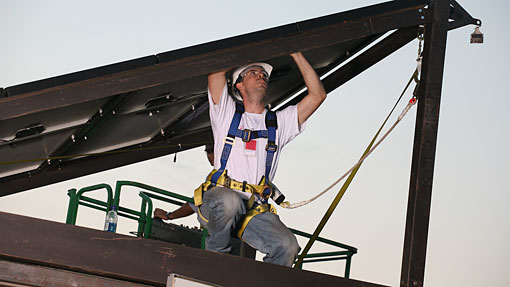 Danny Bass raises the groHome roof.