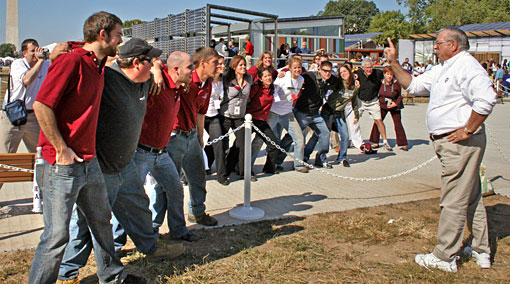 Constrcution science professor Bob Segner, a former Aggie yell leader, drums up some Aggie Spirit on the National Mall, leading the Texas A&M decathletes in a victory yell.